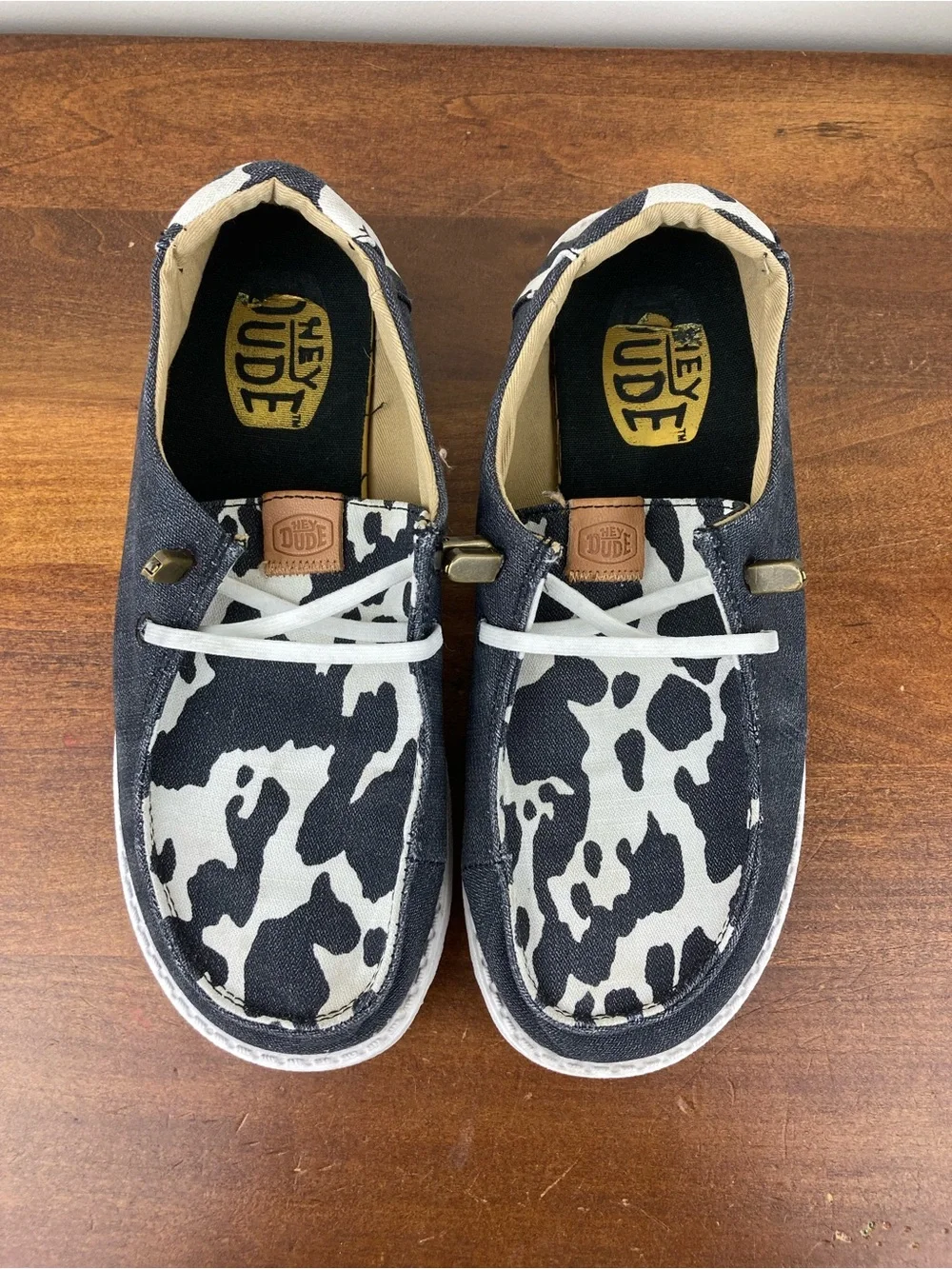 Hey Dude Wendy Animal Black Cow Print Slip-On Shoes 41037-0HO Women's Size 6.